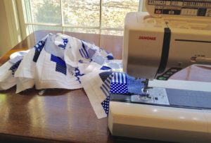 Blue & White Jelly Roll and Honey Bun Curved Log Cabin Quilt in progress